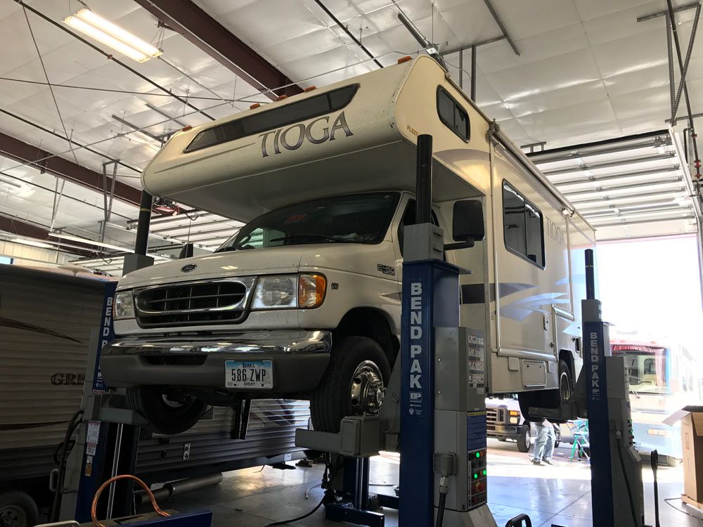 RV on a lift for undercarriage repair in Salt Lake City, UT
